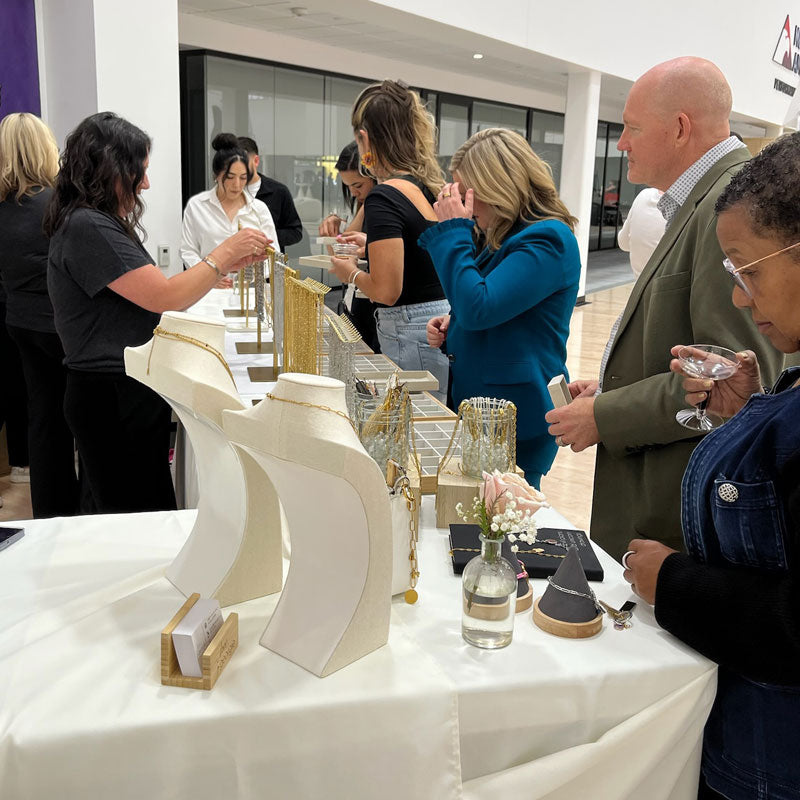 People gathered around a charm bar table.